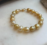 Elly’s 8.9-11.2mm 16pcs Genius South sea golden Ocean Pearls bracelet: Extreme luster, 8.1”, S925 silver bracelet.