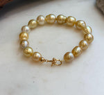 Elly’s 8.9-11.2mm 16pcs Genius South sea golden Ocean Pearls bracelet: Extreme luster, 8.1”, S925 silver bracelet.