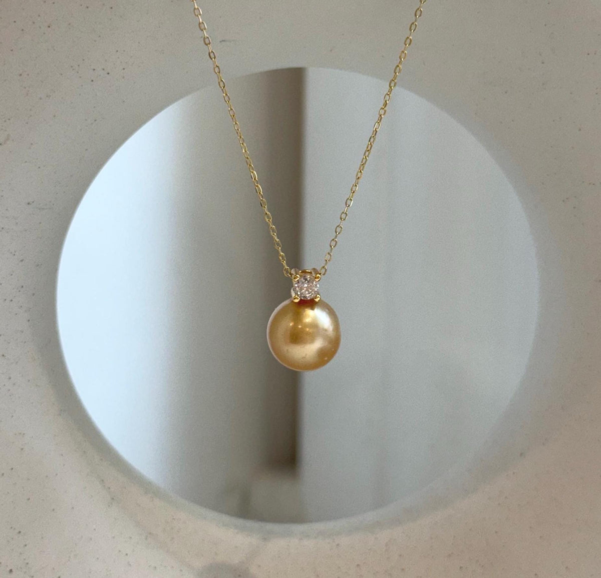 Elly’s 10.9mm South Sea deep tea Gold ocean Pearl pendant: Extreme luster mirrored, 1.5cm high, S925 silver w/ gold plated pendant.