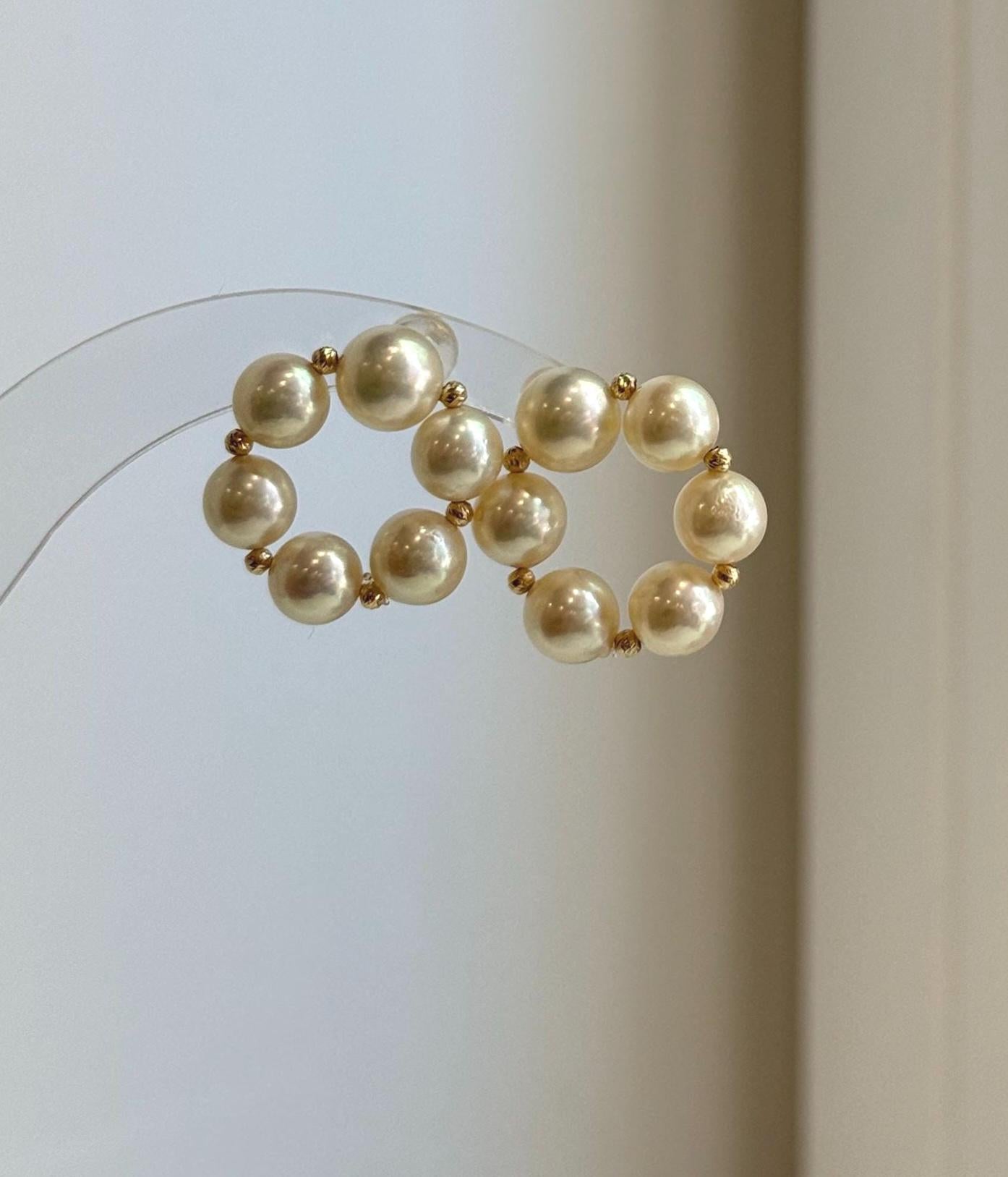 Elegant minimalist Akoya pearl stud earrings with donut-shaped golden pearls for everyday luxury wear.