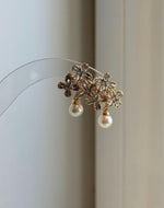 Minimalist ivory Akoya pearl earrings for everyday elegance and special occasions.