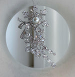 Nature-inspired Tahitian pearl statement brooch measuring 3.5 by 7 cm.