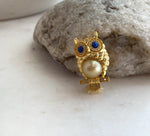 Deep golden South Sea pearl owl pin with mirror-like luster.