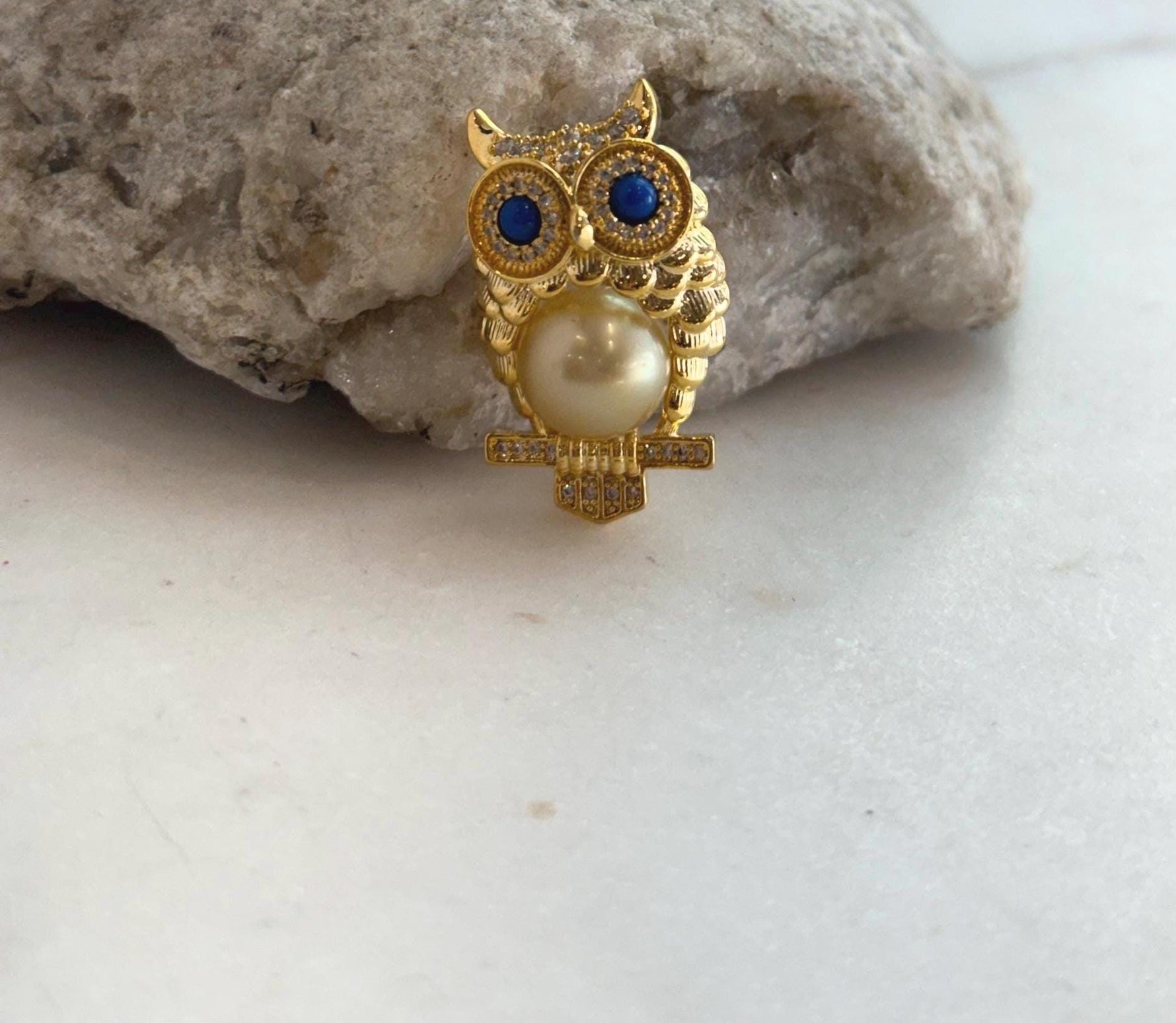 Nature-inspired owl brooch with rich tea gold ocean pearl.
