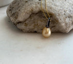 Natural golden South Sea saltwater pearl pendant featuring rich deep tea gold color.