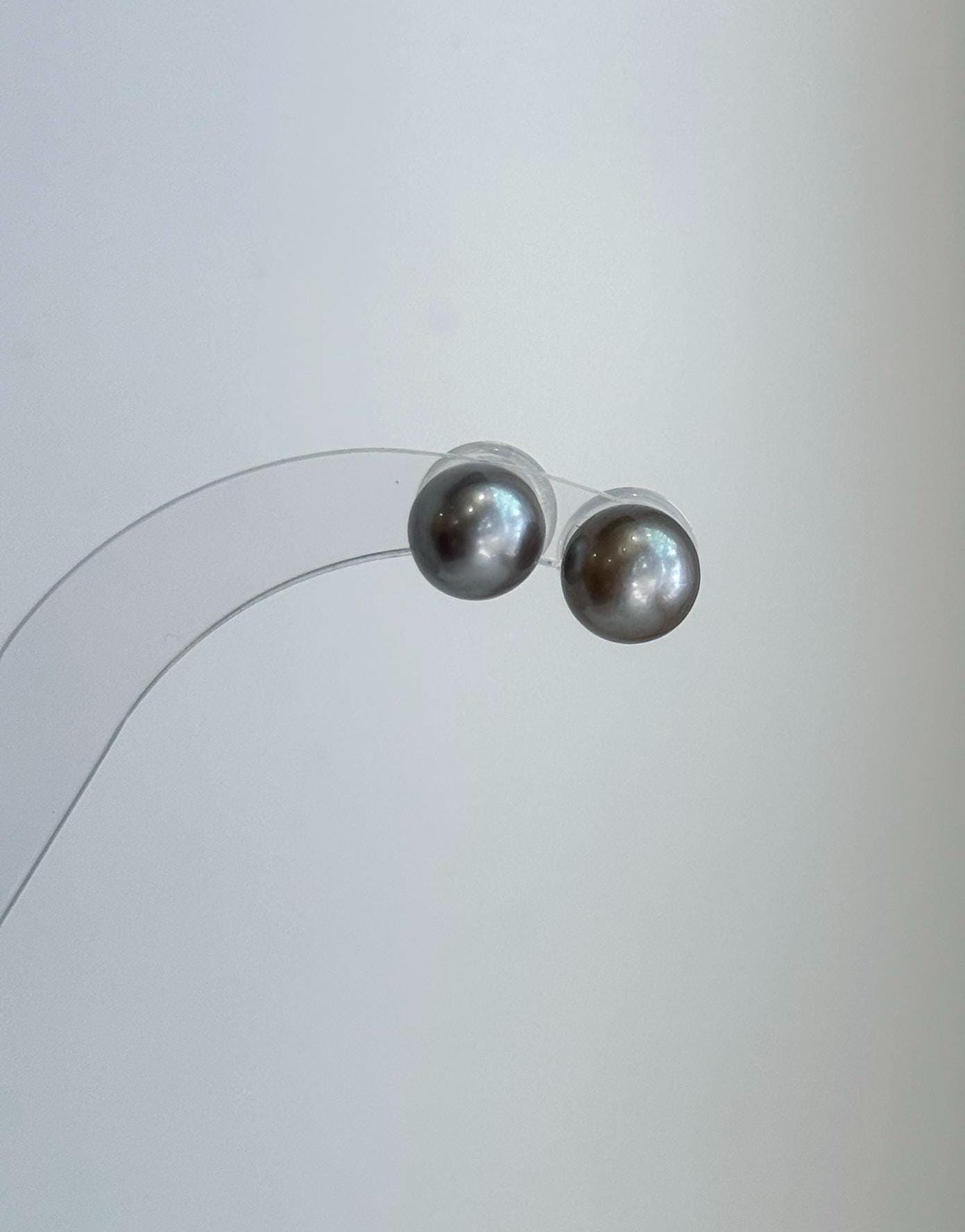 Elegant 9.1mm Tahitian pearl earrings with exceptional mirror luster and sterling silver posts.