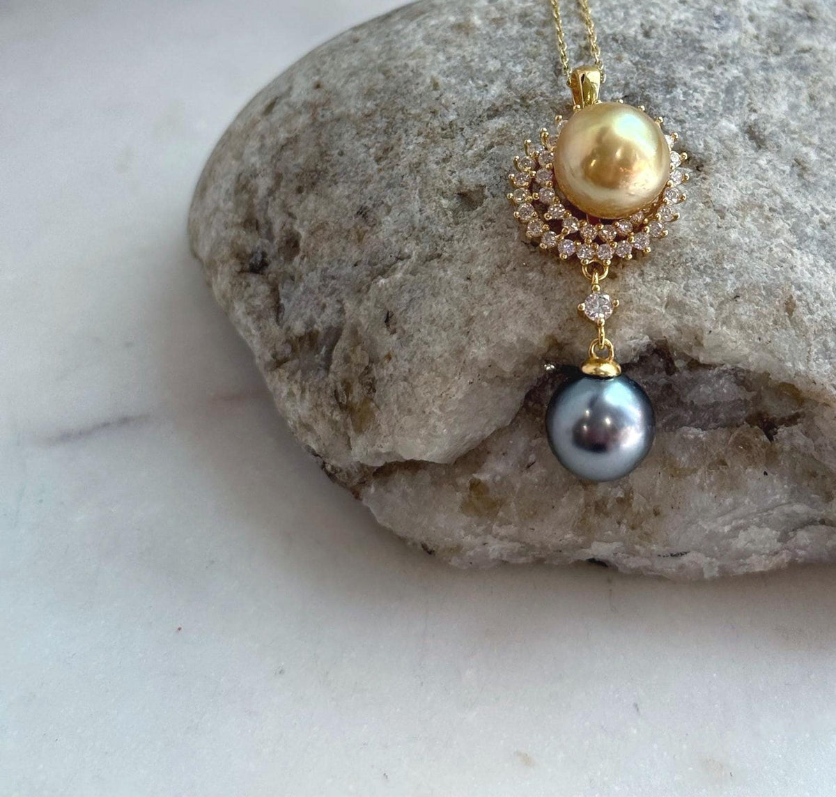 Luxury pendant featuring natural South Sea Golden and Tahitian pearls with exceptional mirror luster.
