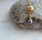 Luxury pendant featuring natural South Sea Golden and Tahitian pearls with exceptional mirror luster.