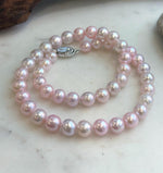 lustrous pale pink genuine pearls with smooth round shape