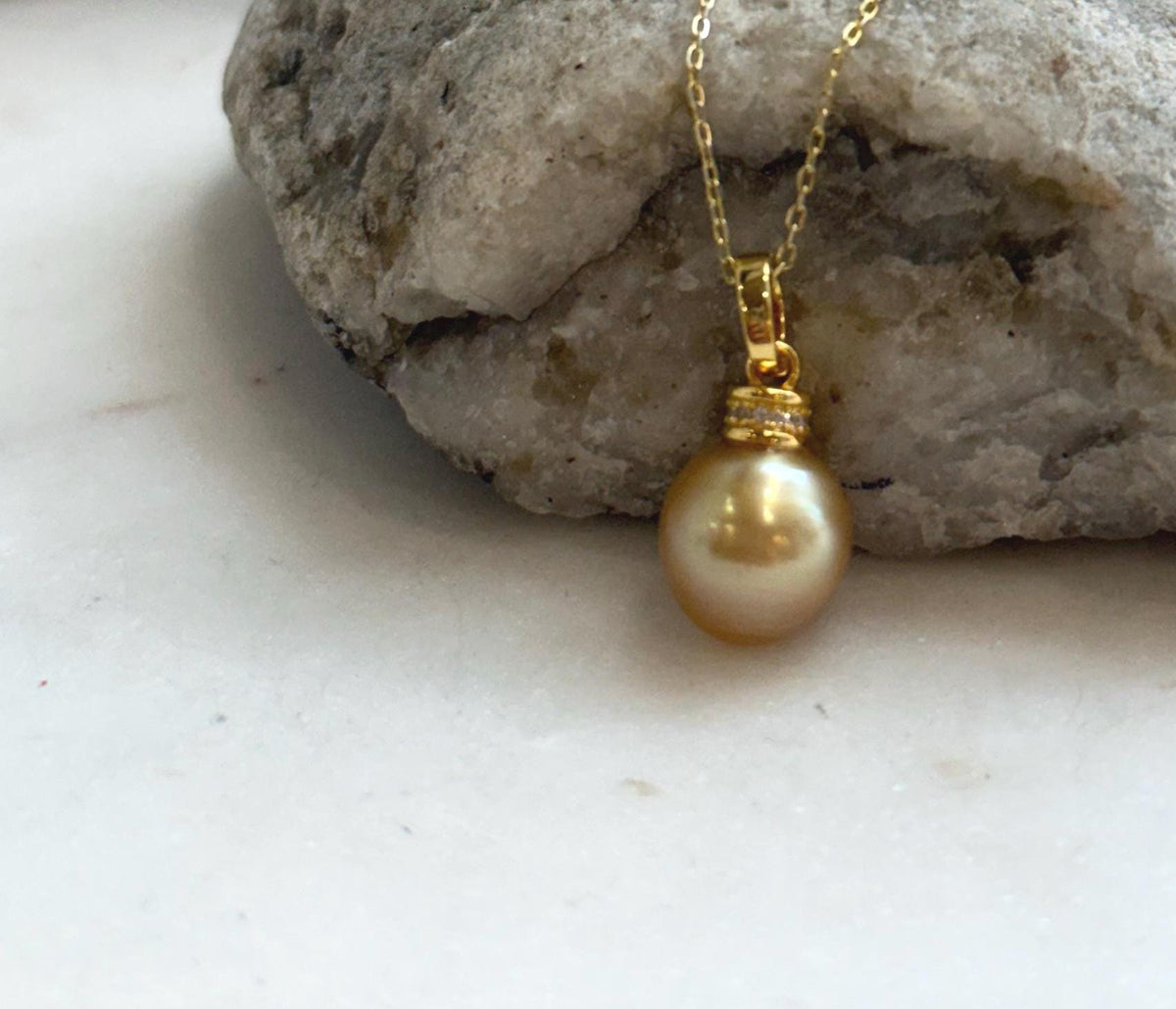 Handcrafted genuine South Sea pearl pendant with a natural 10.4mm deep tea gold pearl and elegant sterling silver setting.