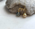 Natural golden South Sea pearl paired with a Tahitian pearl pendant.