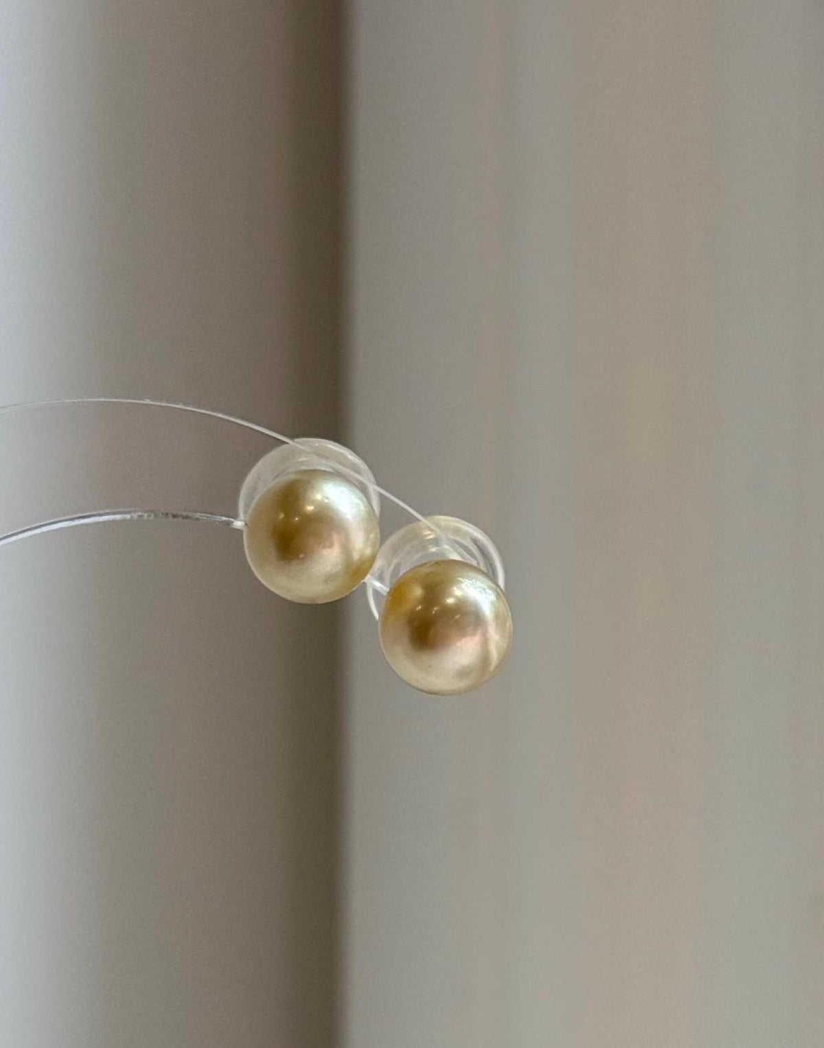 Genuine ocean gold pearls with smooth round shape and high luster.