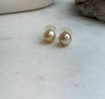 Genuine ocean gold pearls with smooth round shape and high luster.