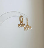 Genuine white freshwater pearl huggie hoop earrings with minimalist style.
