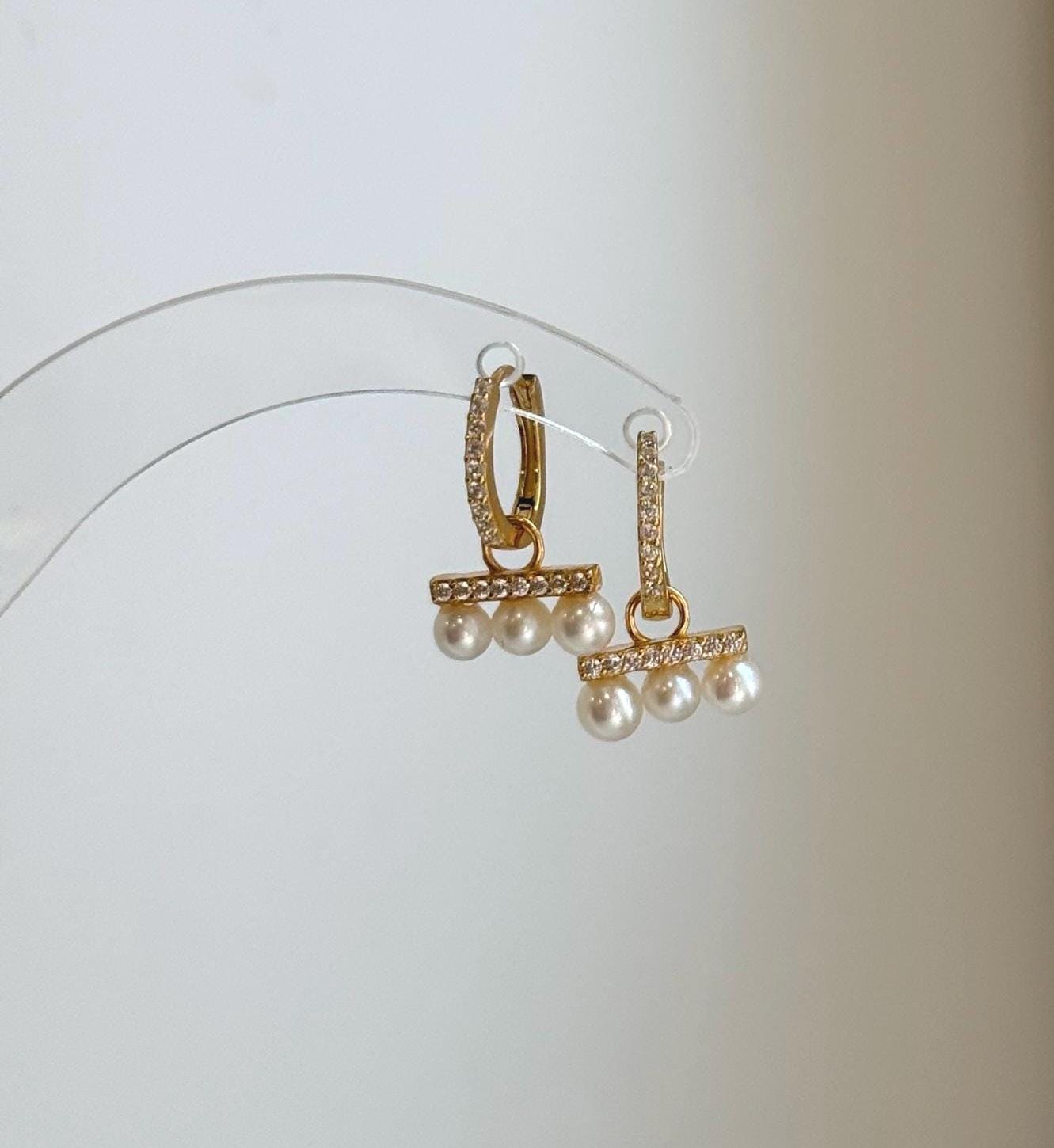 Genuine white freshwater pearl huggie hoop earrings with minimalist style.
