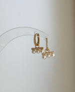 Minimalist pearl huggie earrings perfect for bridal or bridesmaid gifts.