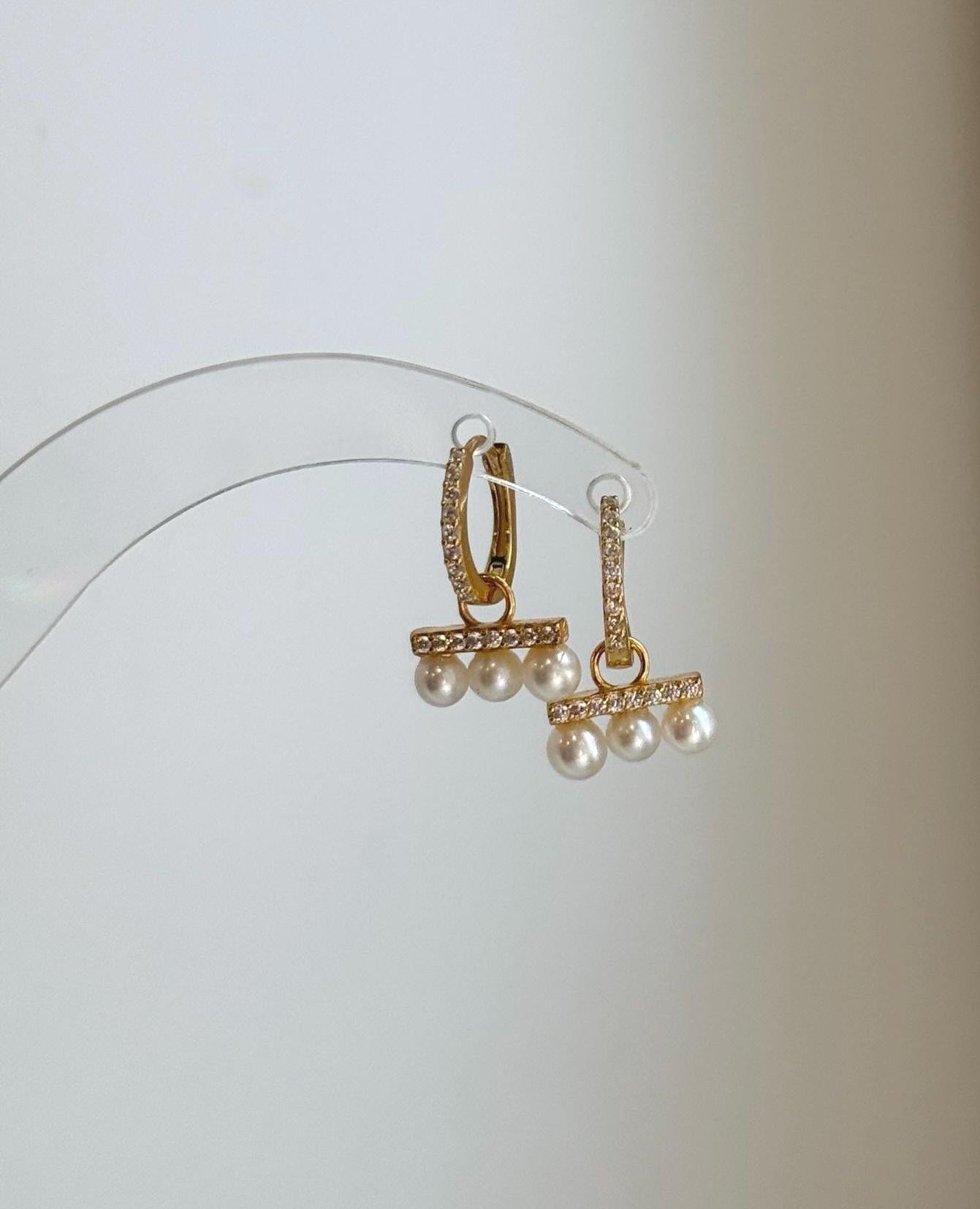 Minimalist pearl huggie earrings perfect for bridal or bridesmaid gifts.