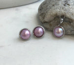 Natural pink iridescent pearl pendant close-up.