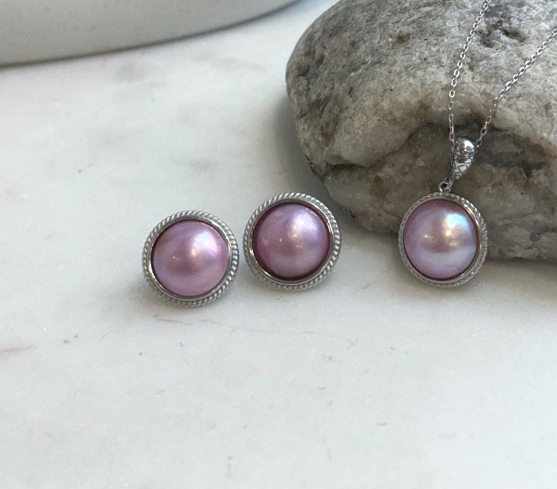 Natural pink iridescent pearl pendant close-up.