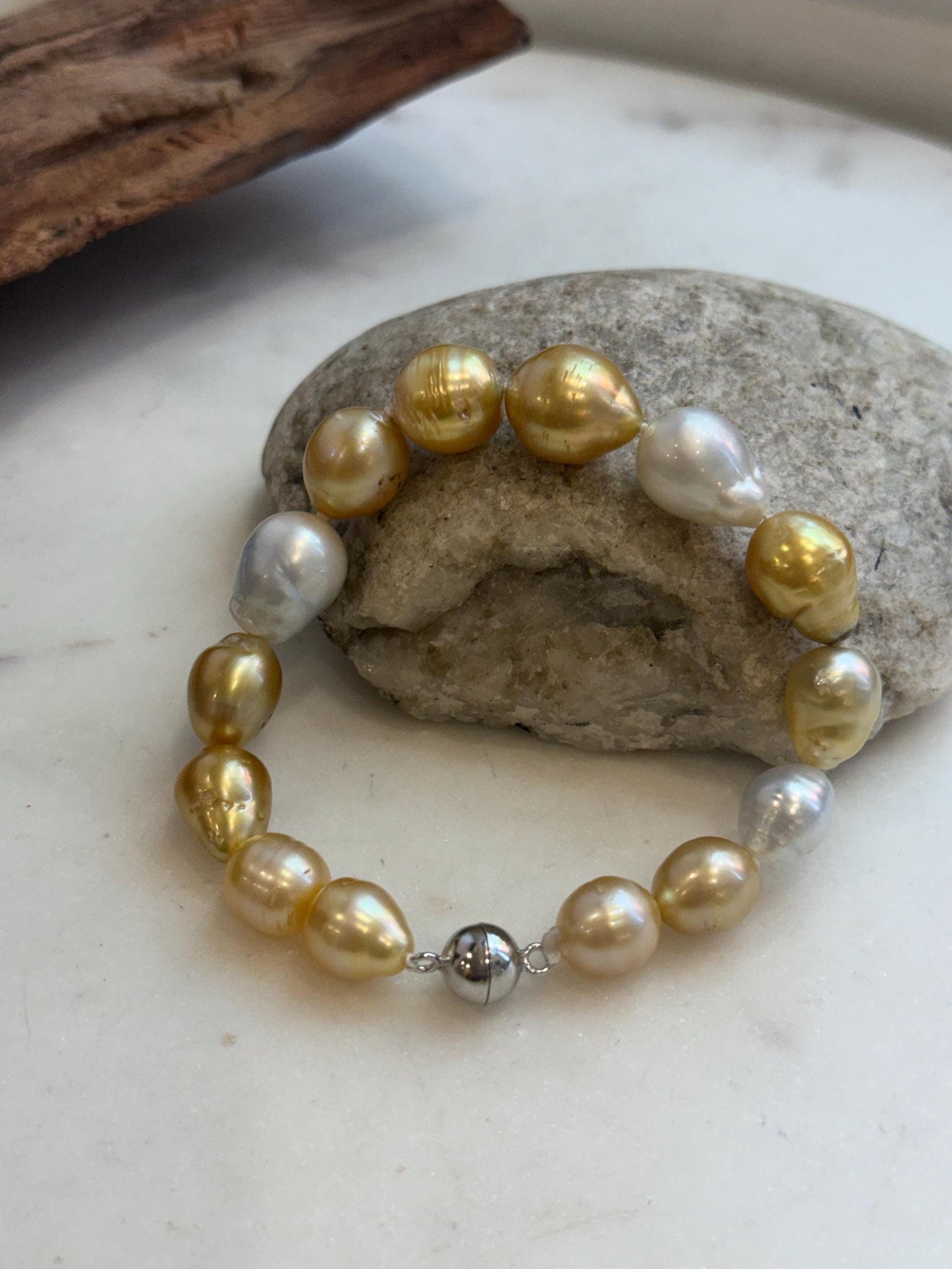 Genuine ocean pearl bracelet with sterling silver clasp.