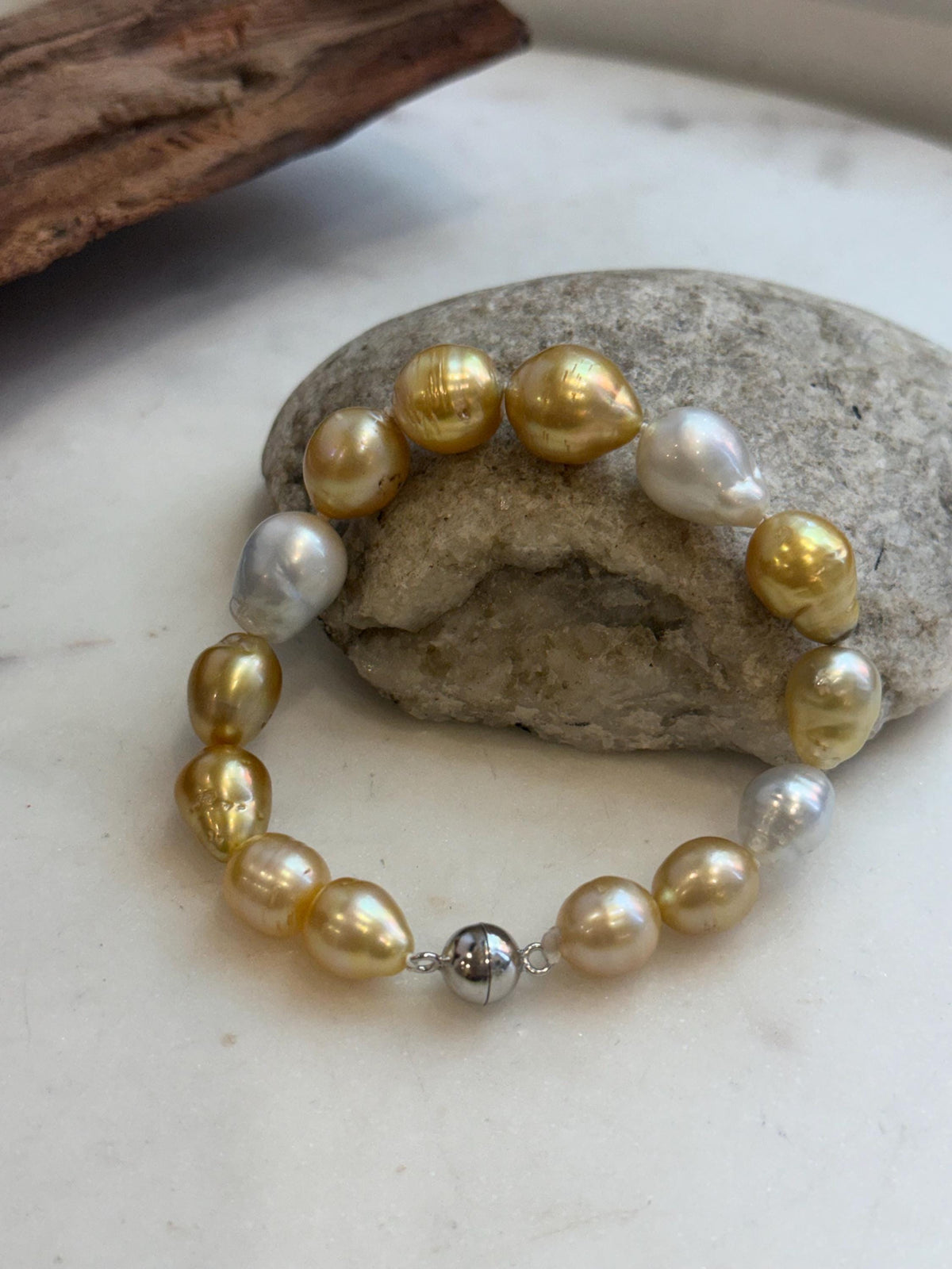 Genuine ocean pearl bracelet with sterling silver clasp.