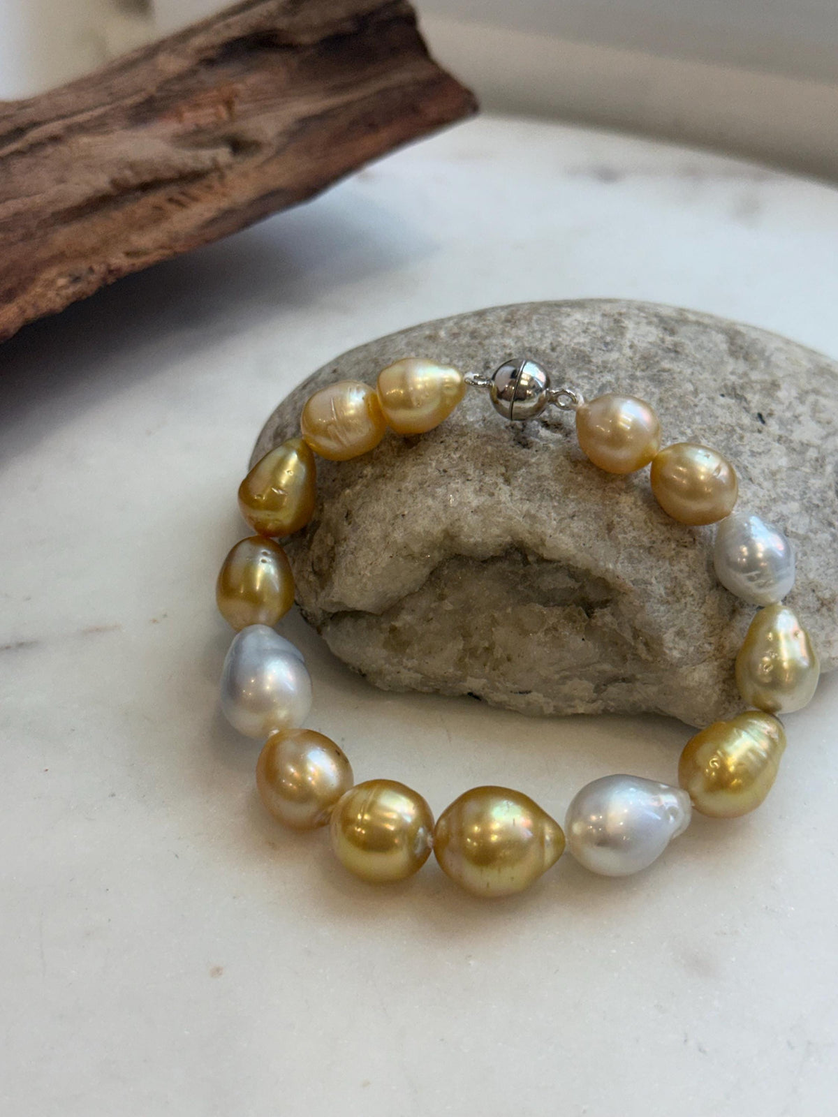 Genuine ocean pearl bracelet with sterling silver clasp.