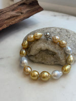 Genuine ocean pearl bracelet with sterling silver clasp.