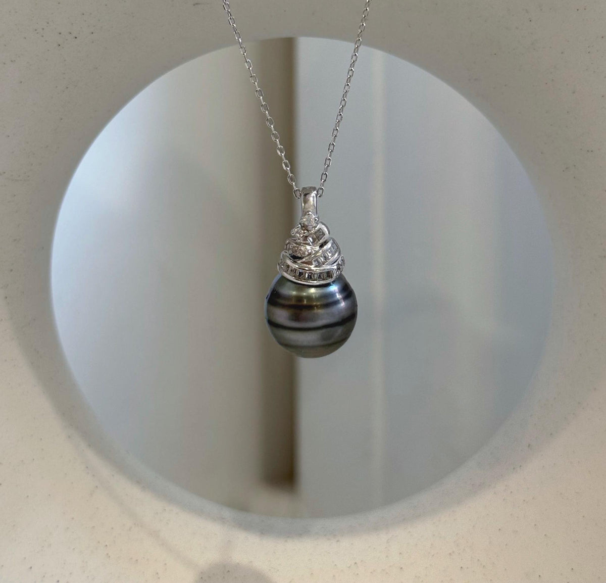 Genuine 12.8mm Tahitian saltwater pearl necklace featuring exceptional mirror-like luster.