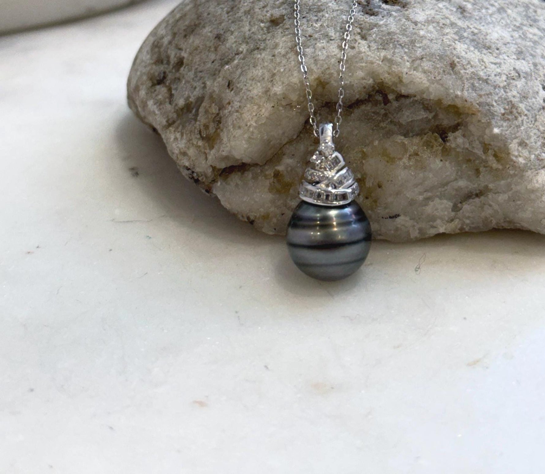 Large black Tahitian pearl pendant crafted with sterling silver for timeless elegance.