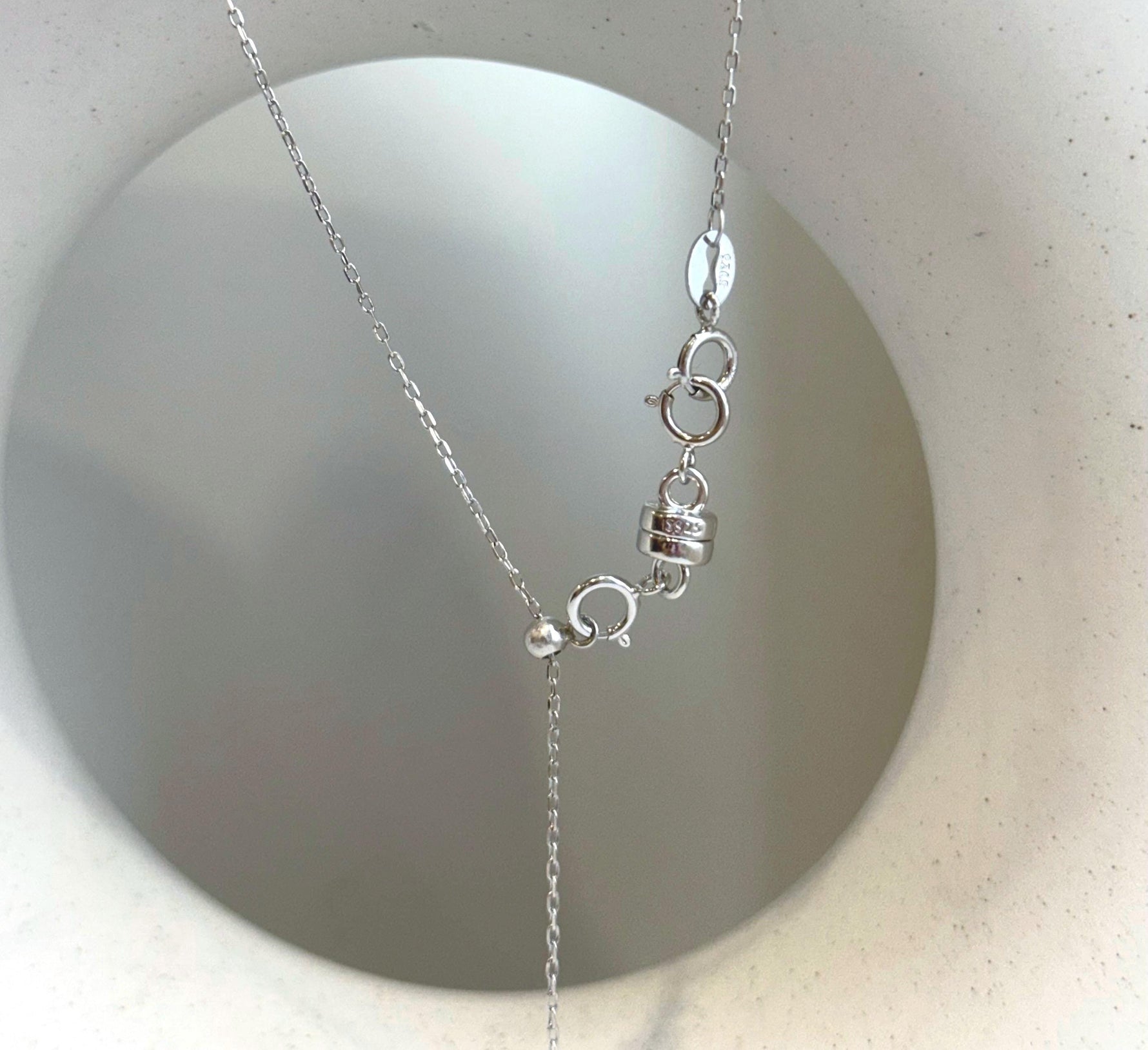 Handmade Tahitian black pearl pendant showcasing a rare large saltwater pearl with mirror shine.