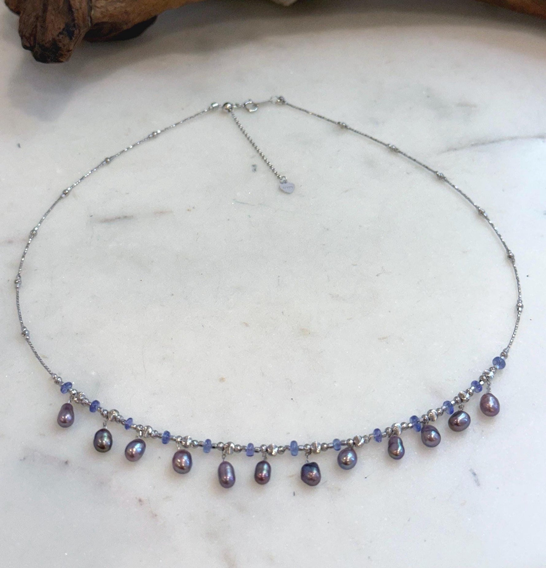 Elegant Keshi pearl necklace with organic freshwater pearls and sparkling Tanzanite.