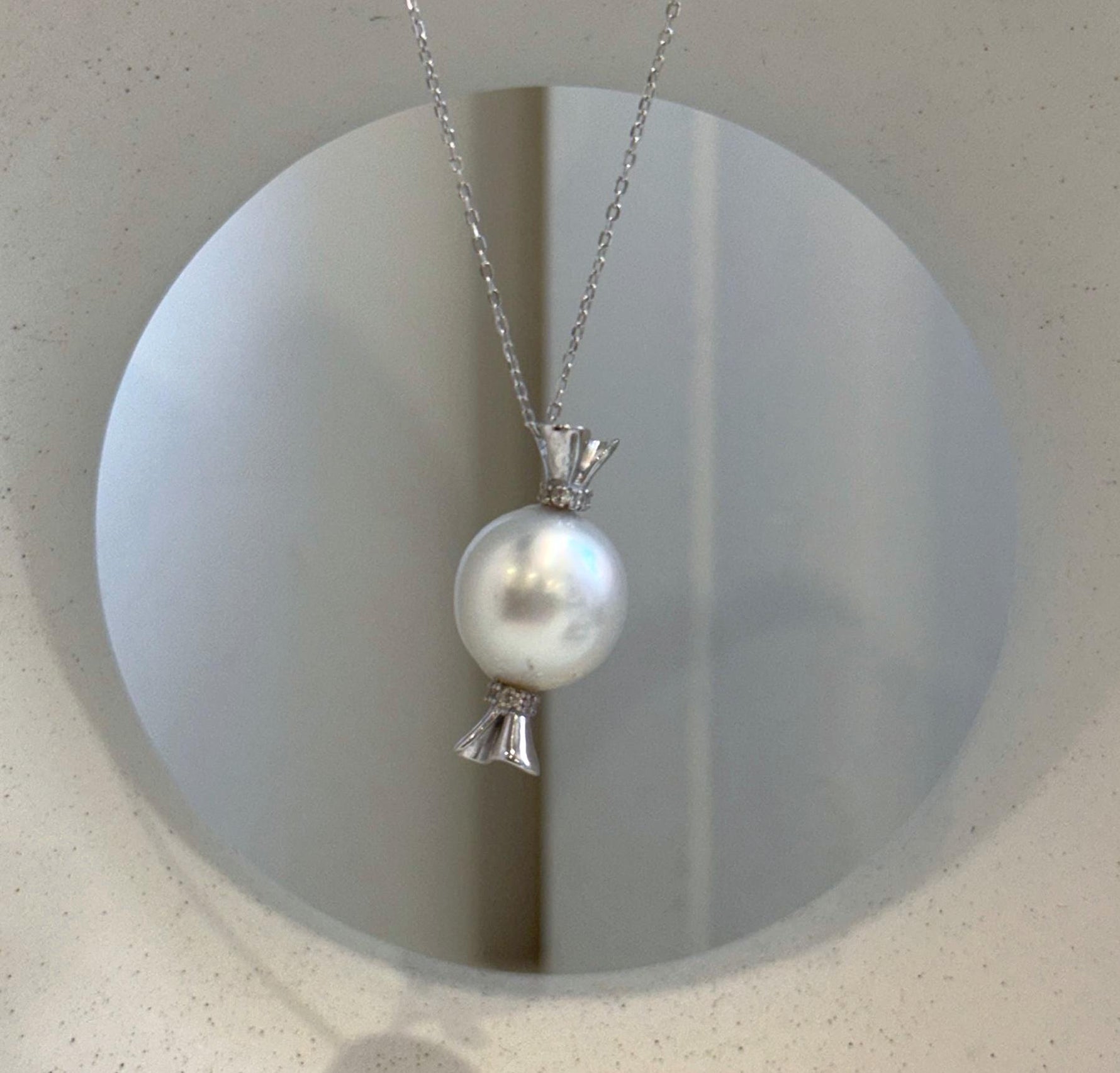Unique candy-inspired pearl necklace featuring a large Australian South Sea white pearl and sterling silver.