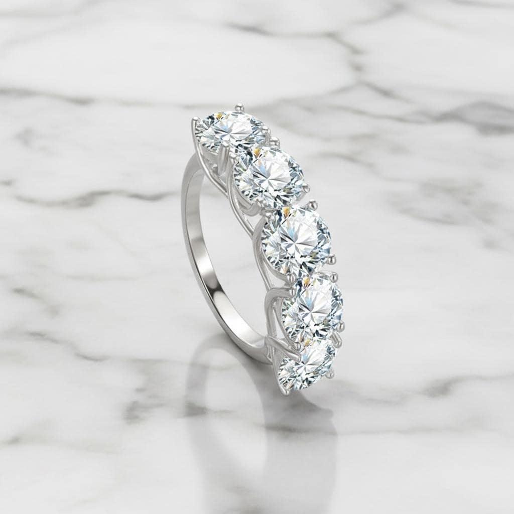 Five stone D VVS1 moissanite ring in sterling silver.