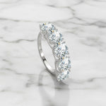 Five stone D VVS1 moissanite ring in sterling silver.