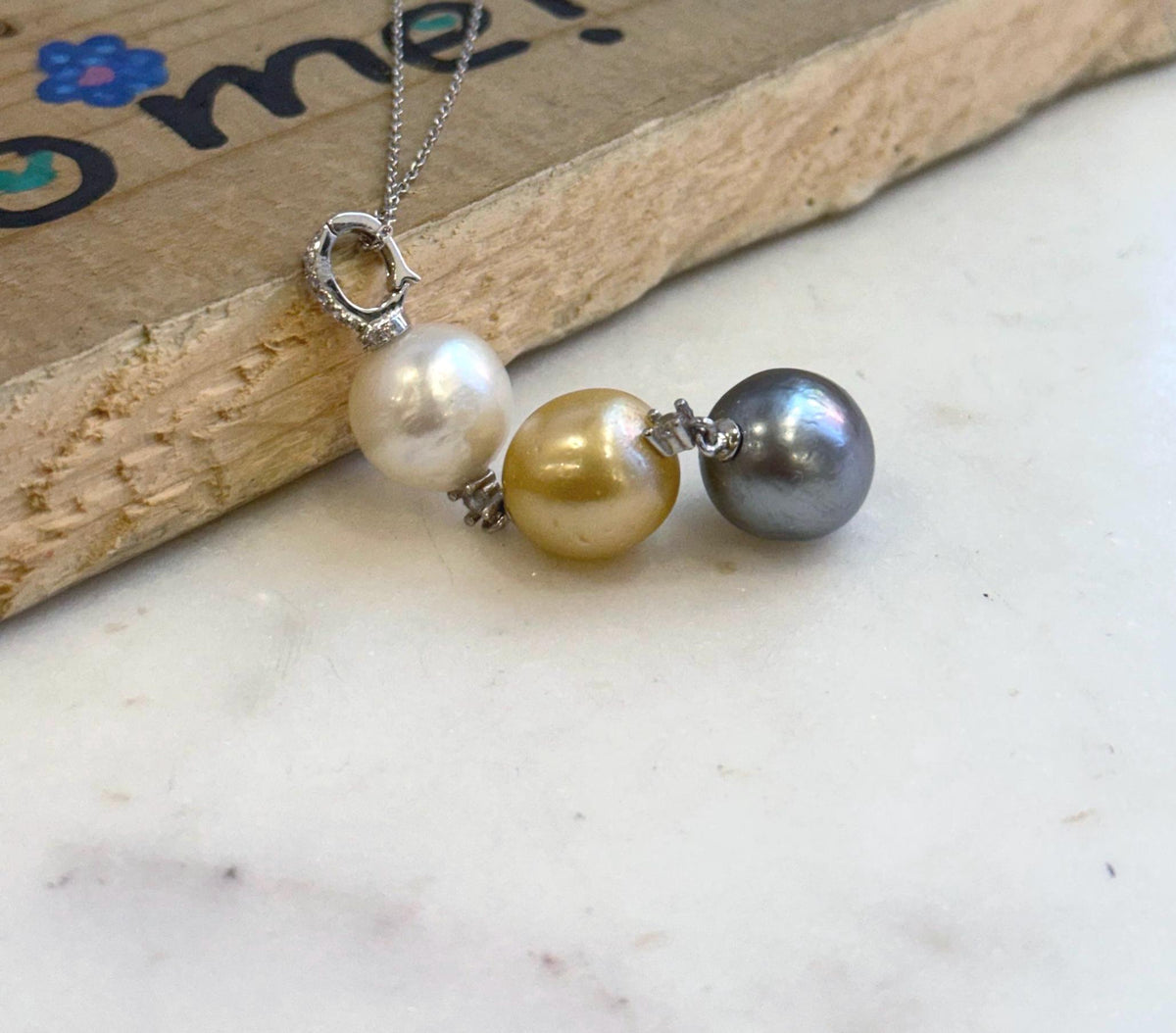Genuine 12.1-12.7mm saltwater pearl pendant featuring three premium ocean pearls.