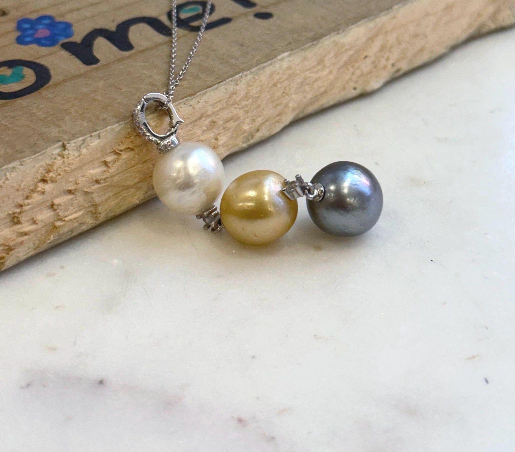 Genuine 12.1-12.7mm saltwater pearl pendant featuring three premium ocean pearls.