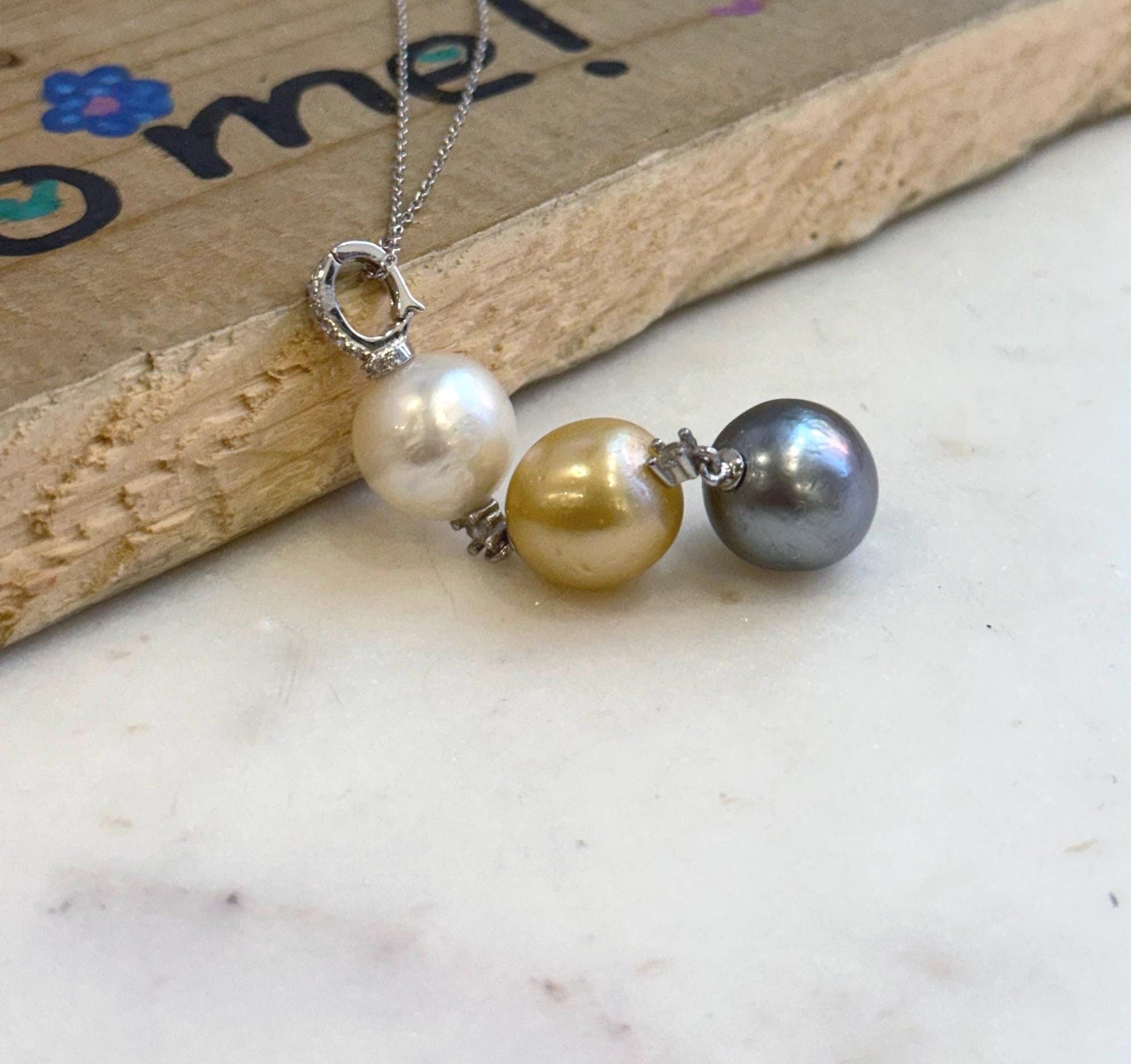 Mirror-luster genuine saltwater pearl pendant measuring 6.1cm on sterling silver chain.