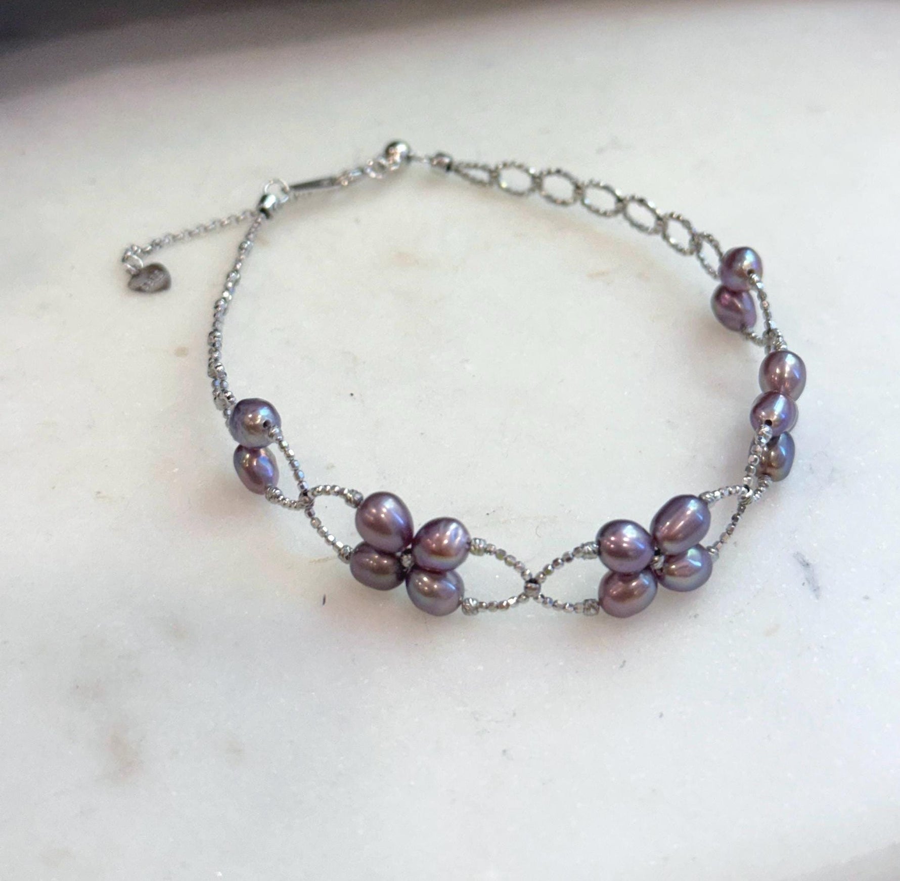 Genuine Keshi pearl bracelet handcrafted with 16 organic freshwater pearls in S925 sterling silver.