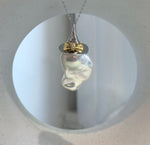 Genuine white baroque pearl pendant with gold bow accent and freshwater pearl stud earrings in S925 sterling silver.