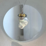 Handcrafted S925 sterling silver baroque pearl pendant necklace paired with genuine freshwater pearl stud earrings.