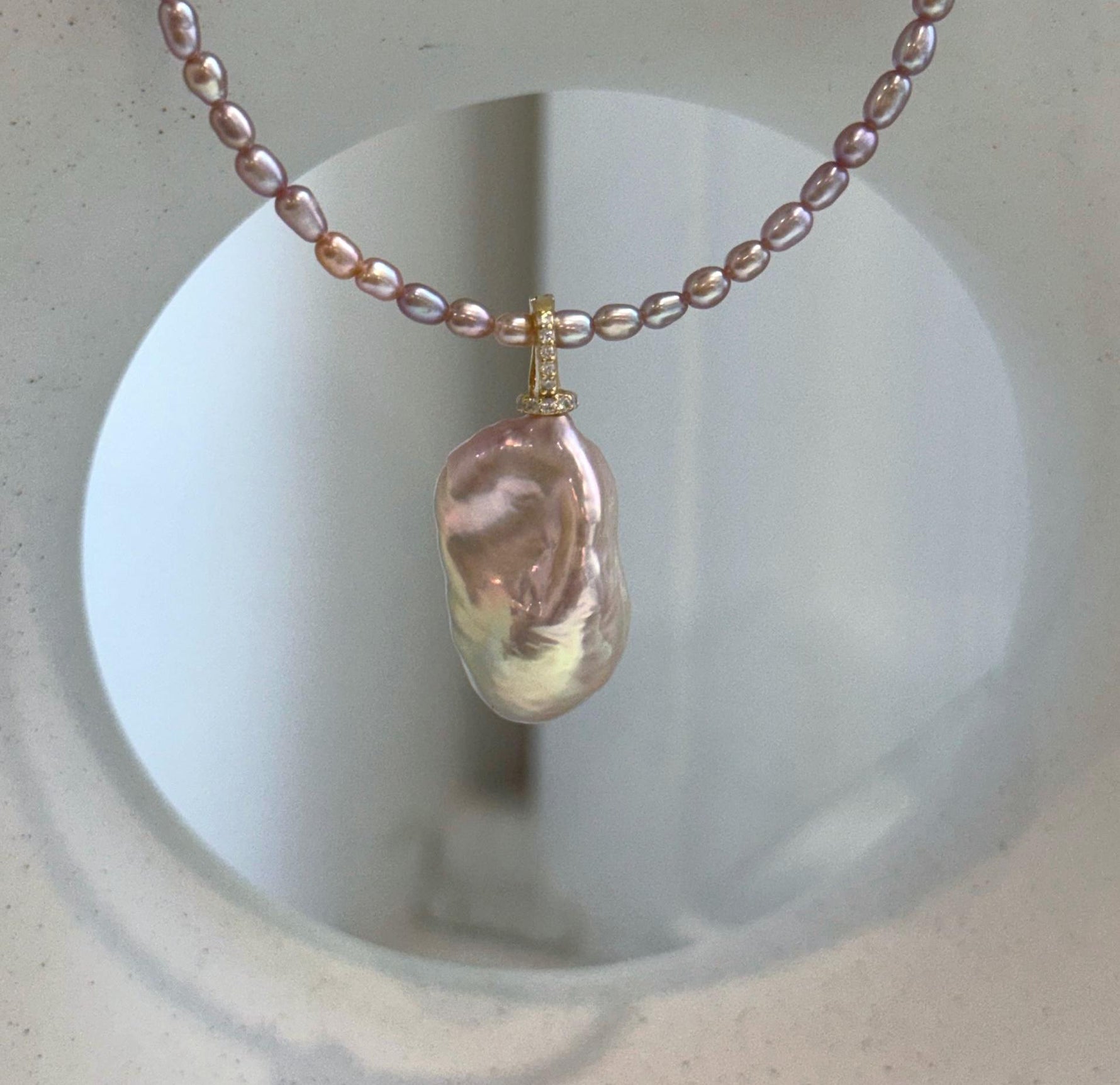 Genuine pink rose pearl jewelry set featuring a large baroque pearl pendant.