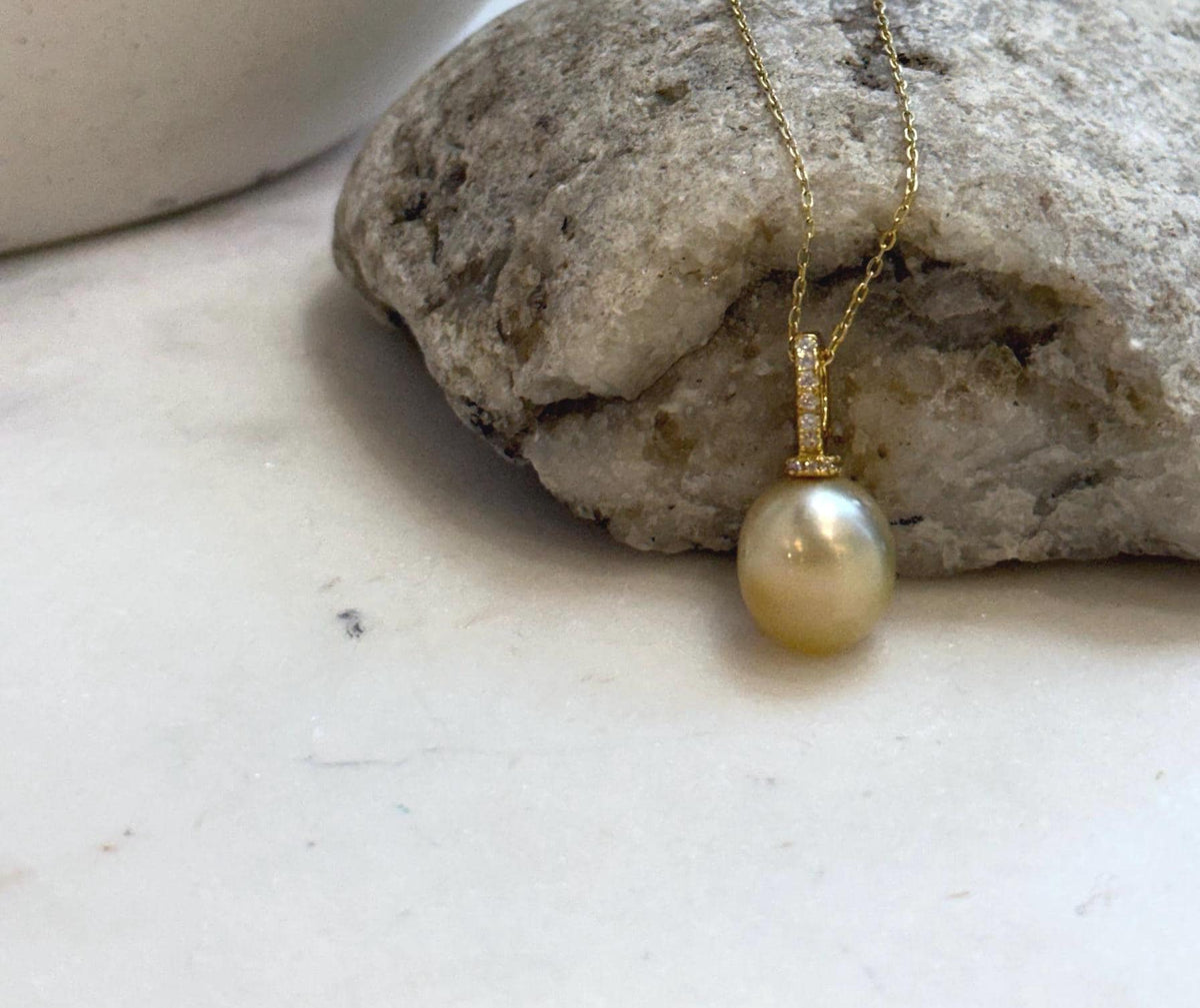 Luxury South Sea golden saltwater pearl on a gold-plated S925 sterling silver pendant.