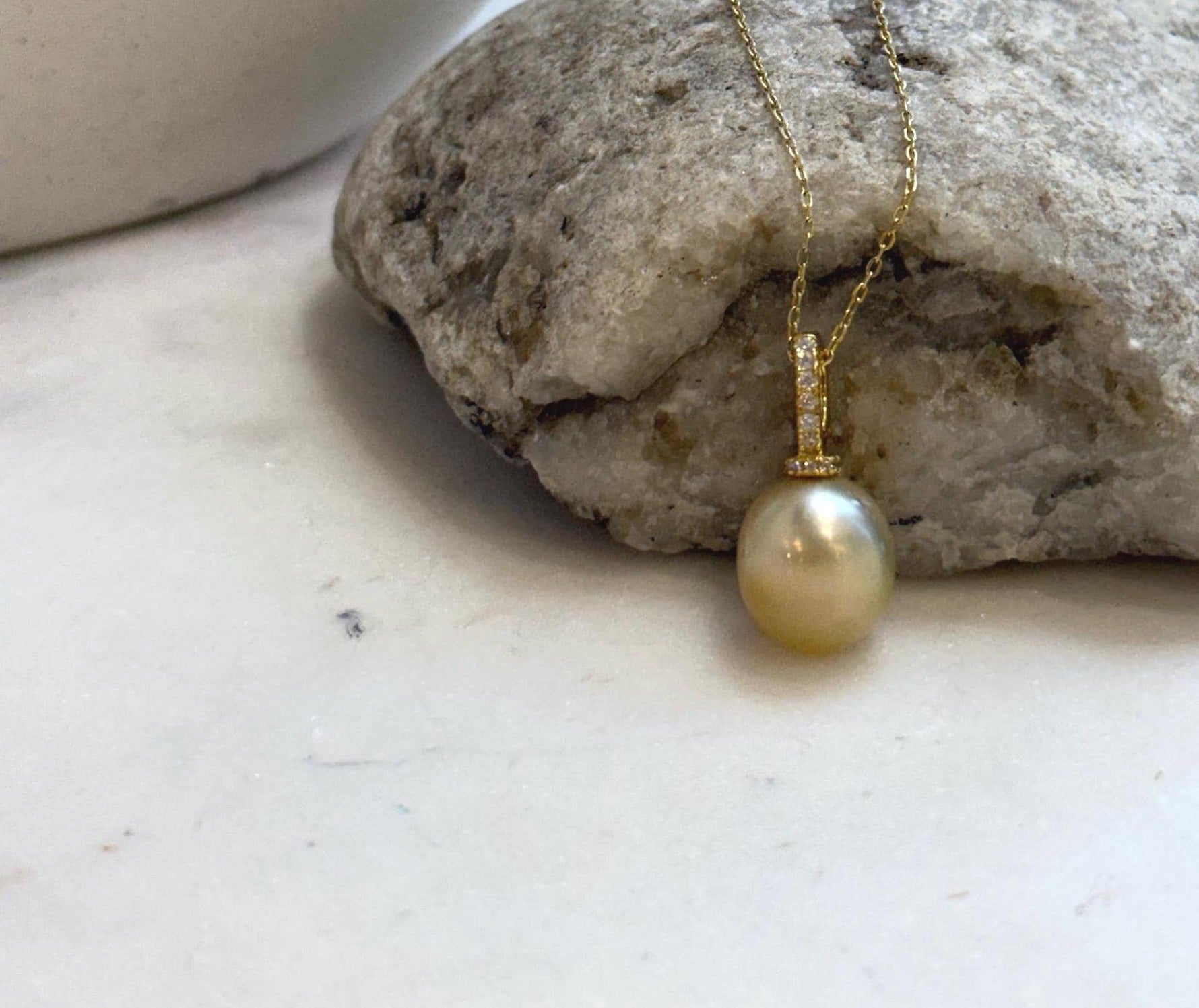 Luxury South Sea golden saltwater pearl on a gold-plated S925 sterling silver pendant.