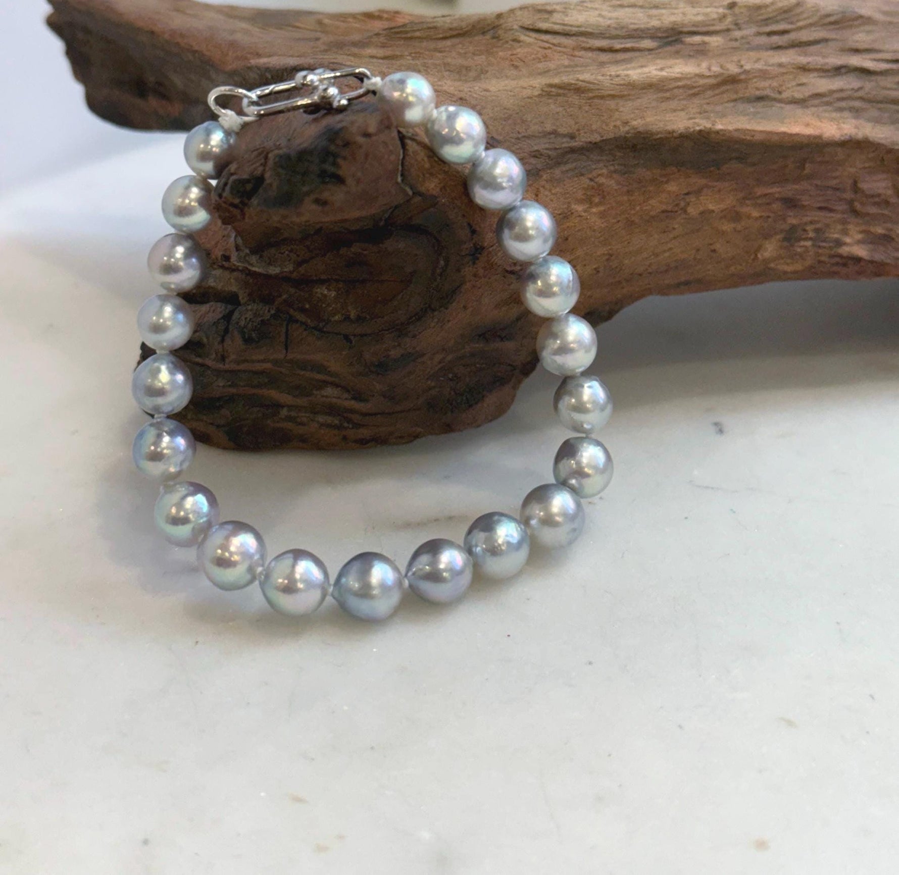 Genuine Japanese Akoya pearl bracelet featuring 21 ocean pearls with exceptional mirror luster.