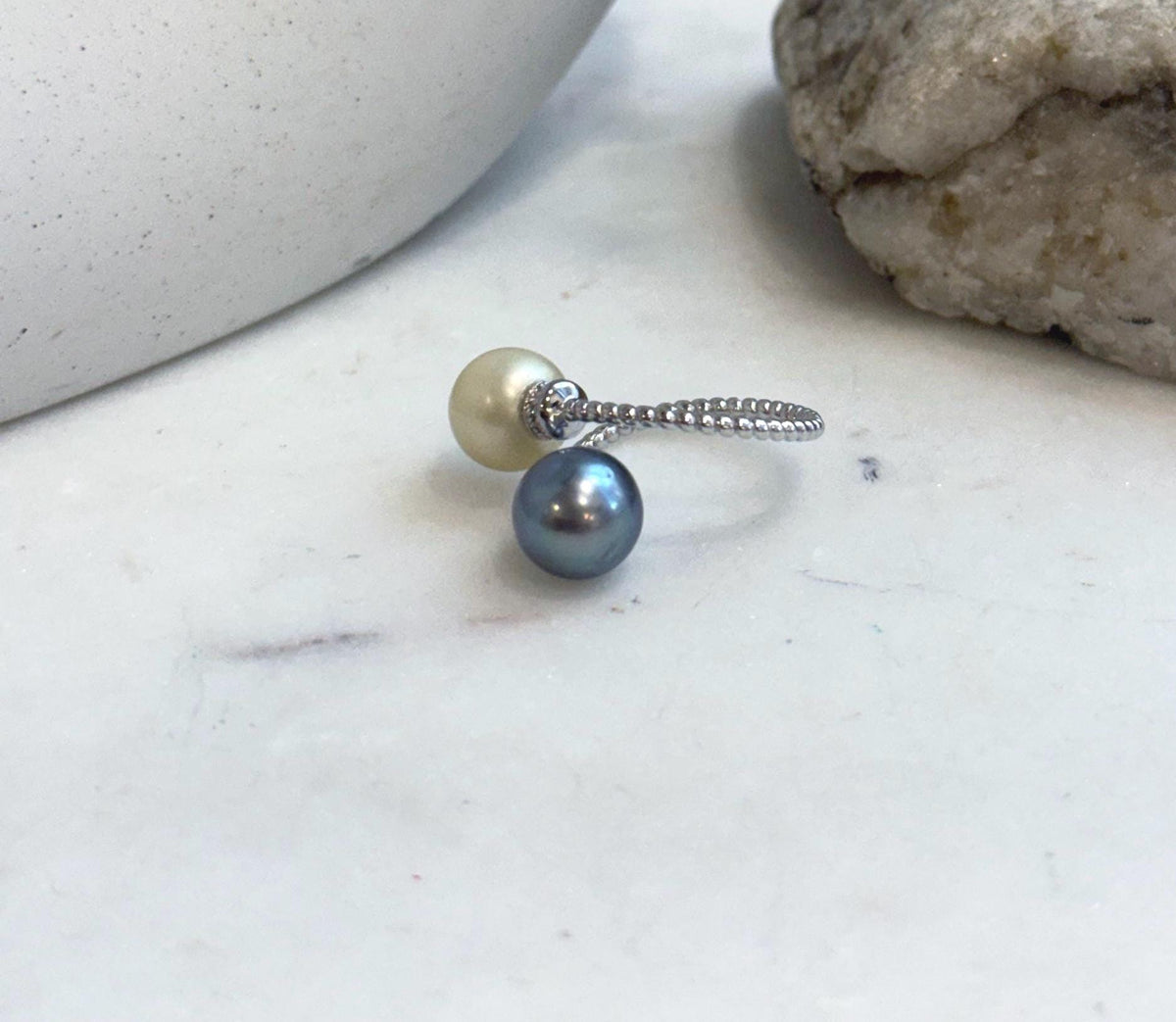 Close-up of genuine South Sea Golden and Tahitian pearl ring with exceptional mirror shine.