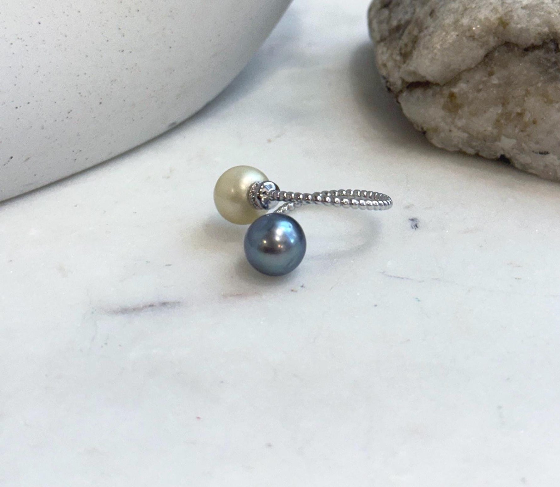 Close-up of genuine South Sea Golden and Tahitian pearl ring with exceptional mirror shine.