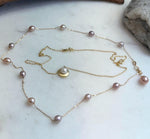 Handmade Akoya saltwater pearl necklace layered with freshwater Keshi pearl sterling silver chain.