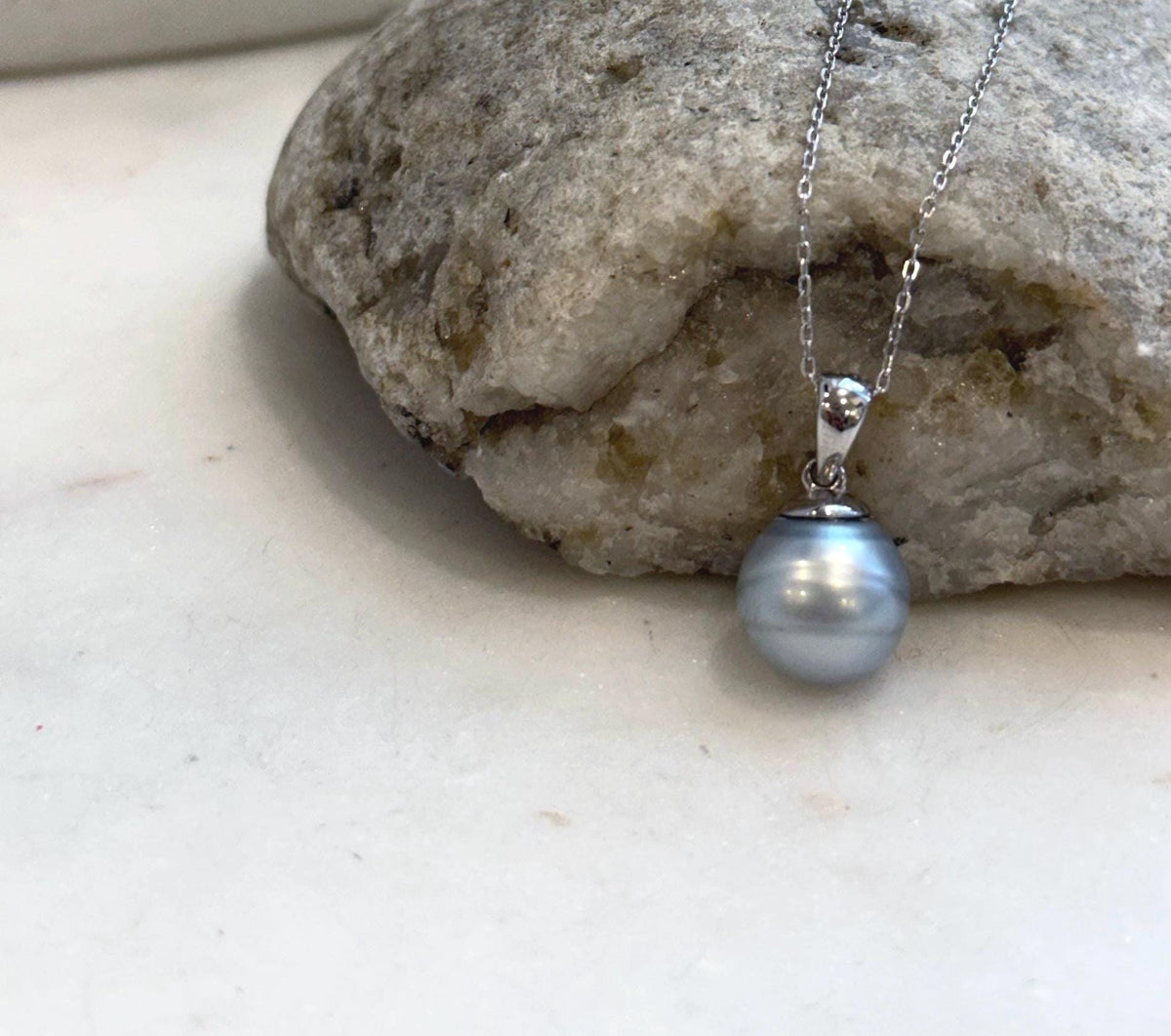 Close-up of natural 11mm Tahitian pearl with smooth surface