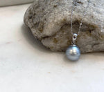 Close-up of natural 11mm Tahitian pearl with smooth surface