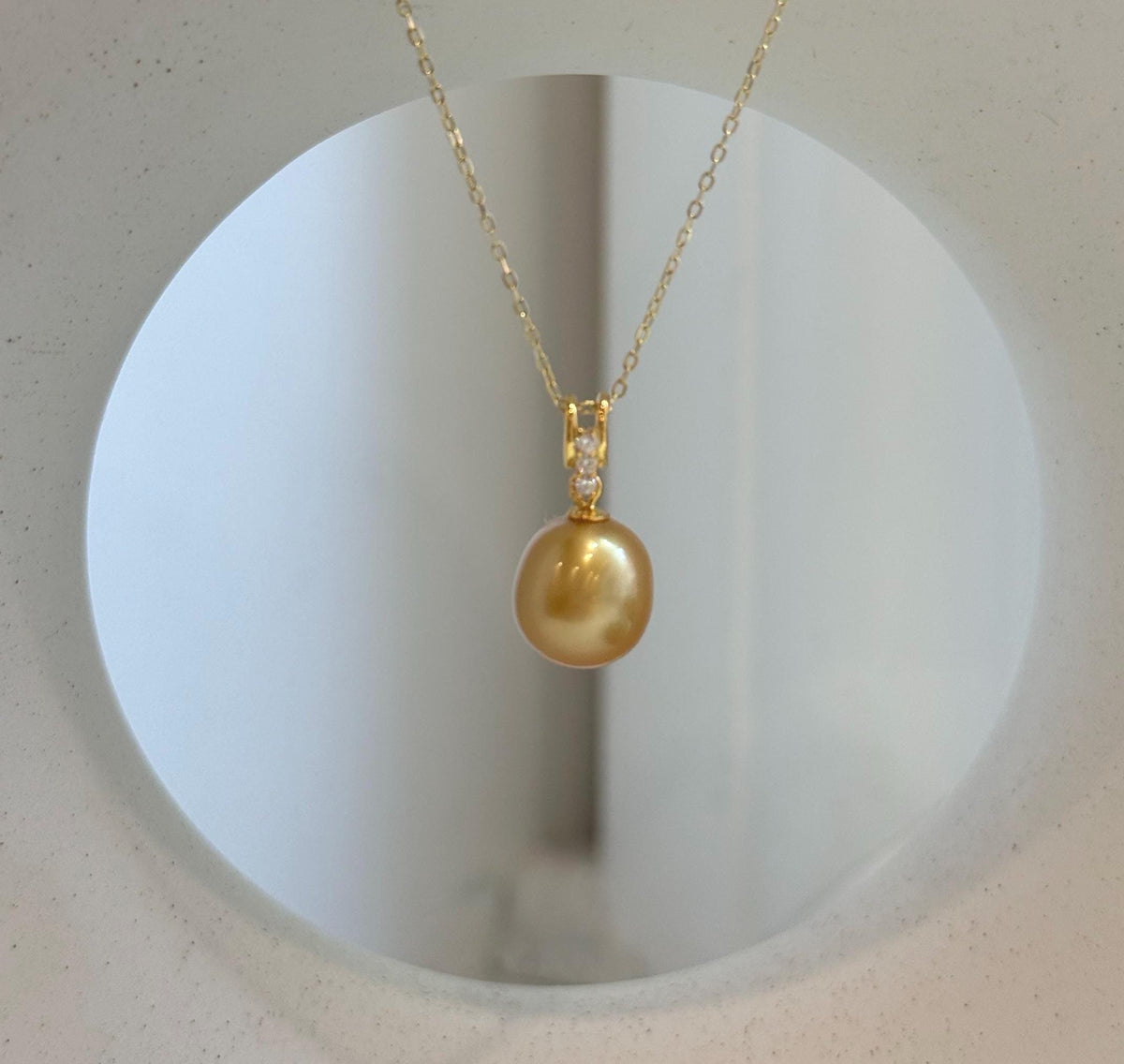 Genuine 10.2mm South Sea deep gold pearl pendant with mirror luster and gold-plated S925 sterling silver.
